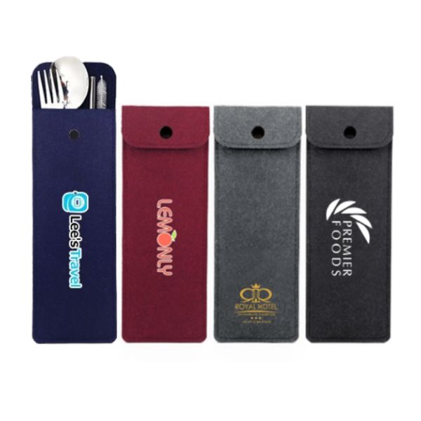 Three felt pouches in navy, maroon and dark grey holding cutlery and straws, each printed with a logo