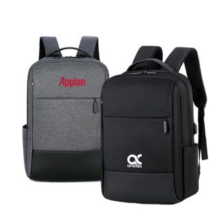 Grey backpack with a black base panel beside a black one with a front zip pocket and side USB port, both printed with a logo.