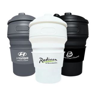 Three collapsible silicone cups with flip lids in grey, white and black, each printed with a logo.
