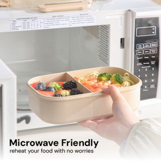 Bamboo fiber lunch box being placed into a microwave oven
