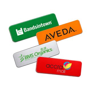 Acrylic name tags in green, white, orange and red, each UV printed in full colour with a company logo