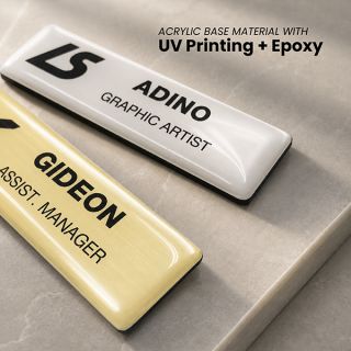 Gold and white epoxy coated acrylic name tags UV printed with company logos and job titles