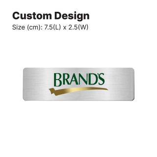 Size guide for the metal engraved name tag, a 7.5 by 2.5cm gold badge carrying a logo