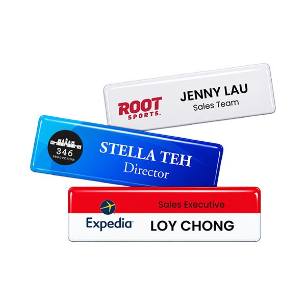 Epoxy coated acrylic name tags in blue, white and red, printed with names and job titles