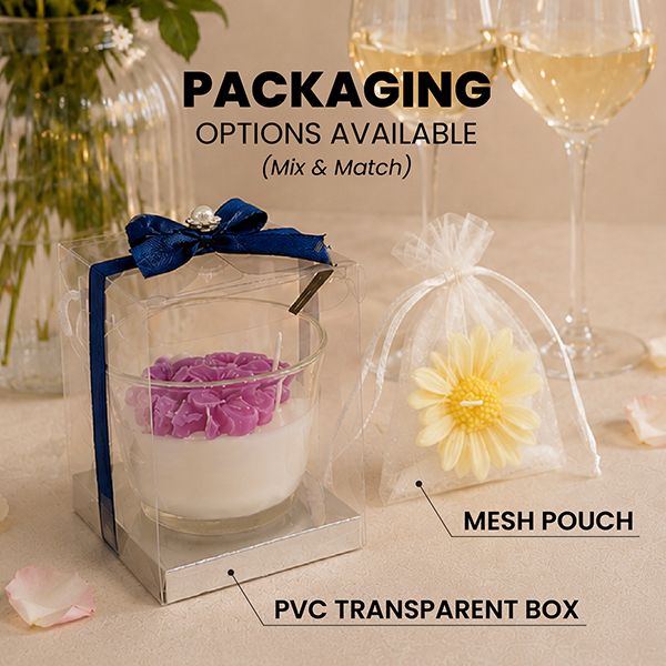 A shaped soy wax candle in a clear PVC box tied with a navy ribbon, next to a flower candle in a white mesh pouch