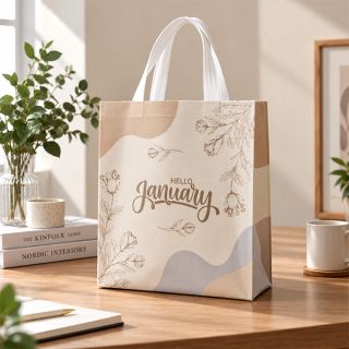 Beige ultrasonic bag with botanical line art and script wording standing on a wooden desk beside plants and books.