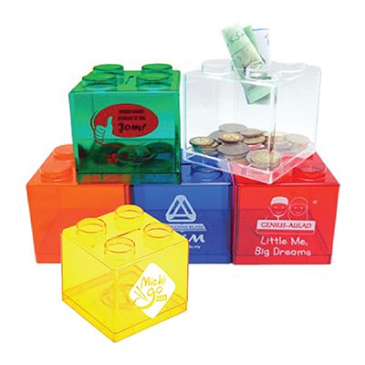 Brick shaped coin boxes in green, clear, blue, red and yellow holding coins and notes, each printed with a logo