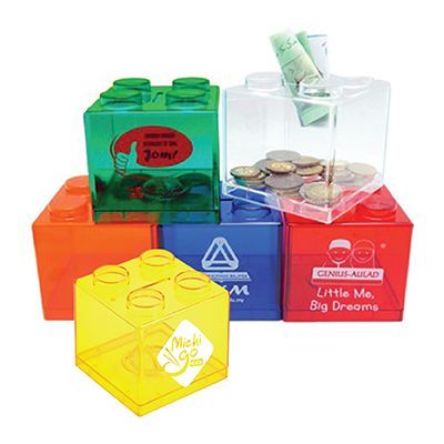 Brick shaped coin boxes in green, clear, blue, red and yellow holding coins and notes, each printed with a logo