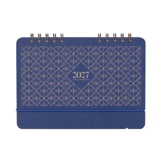 Navy blue desk calendar with a gold diamond lattice cover and rose gold twin wire binding.