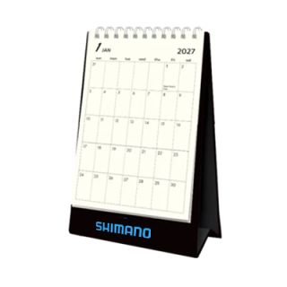 Plan Your Days desk calendar open at a monthly date grid, with a clear printing area below the dates
