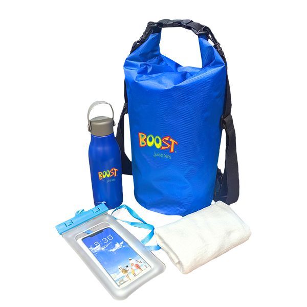 Blue dry bag with a shoulder strap beside a blue bottle, a waterproof phone pouch and a towel, printed with a logo