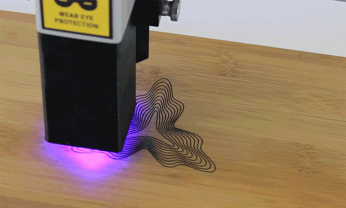 Laser engraving a design into a hard surface